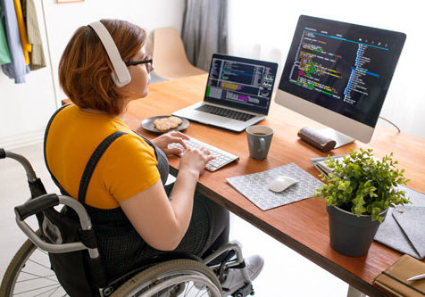 Woman-in-wheelchair-working-at-computer